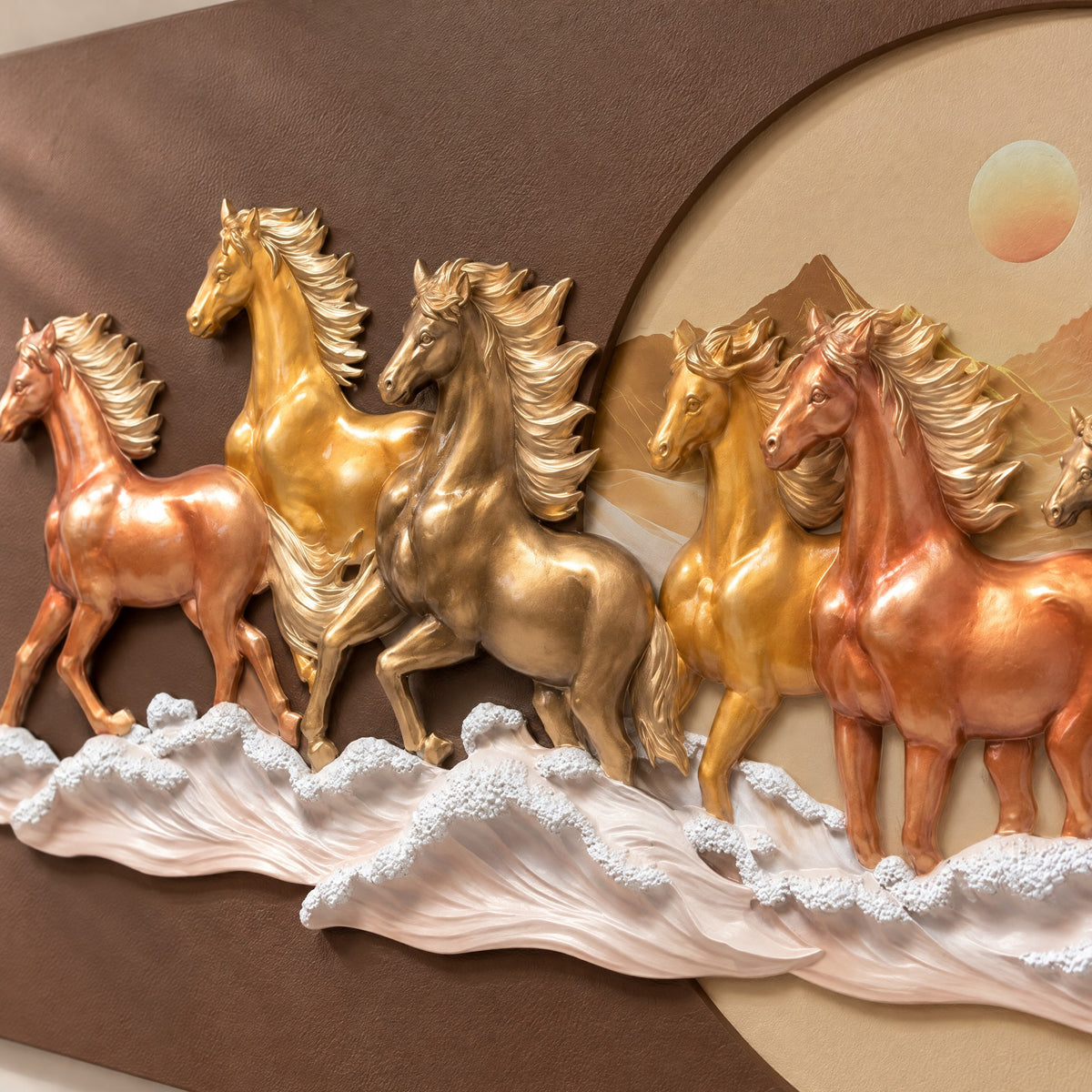 Close-up of the sculpted copper, gold and bronze horses and white wave crests in polyresin relief