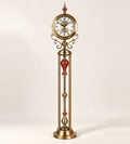 Grand Monarch floor clock, 166 cm, in brass finish with oxblood-red ceramic accents, on an ivory background