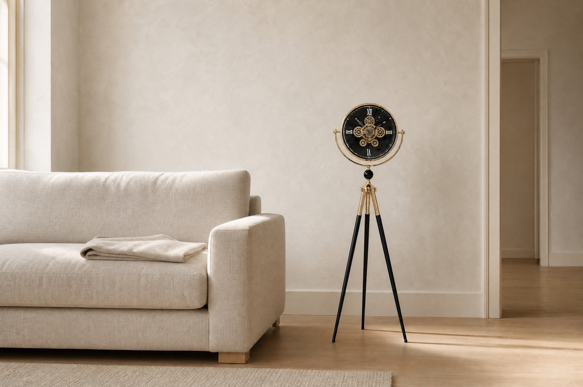 Shadow Line tripod floor clock beside a linen sofa in a calm living room, showing its 137 cm height