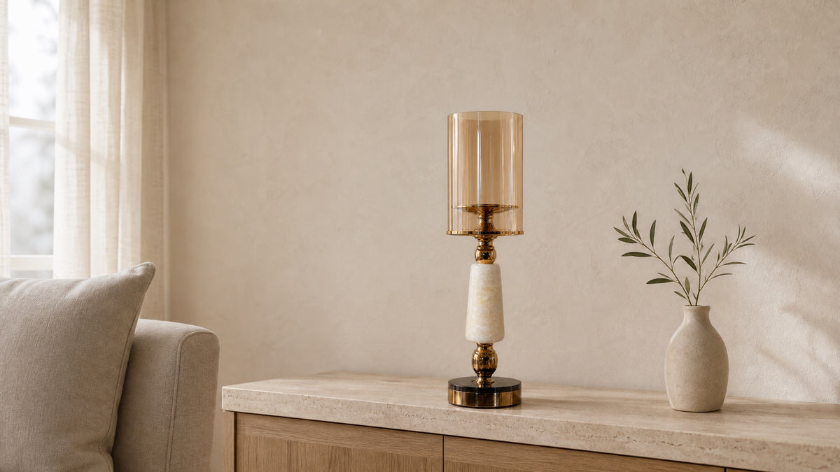 Soluxe onyx marble hurricane candle holder on an oak and travertine console in a calm living room